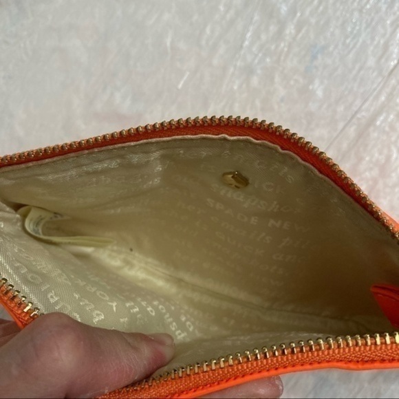 Kate spade orange wristlet bag